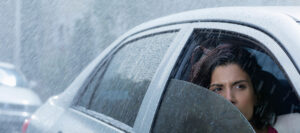 Graded exposure: Woman driving in alternate weather conditions